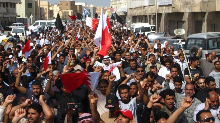 People marching through the streets of Sitra